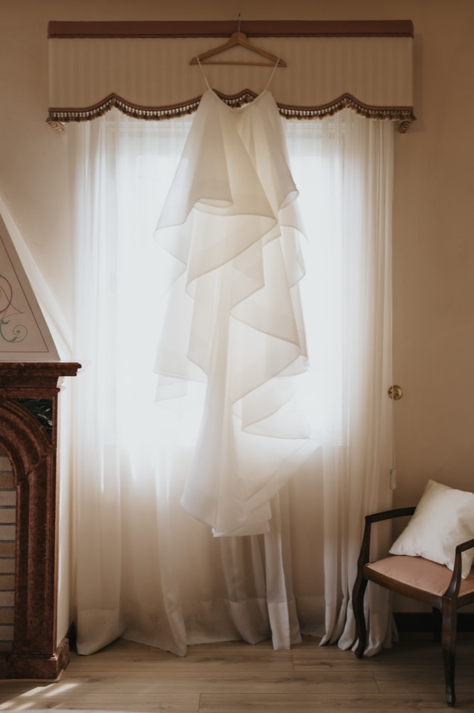 Wedding dress backlit in a room