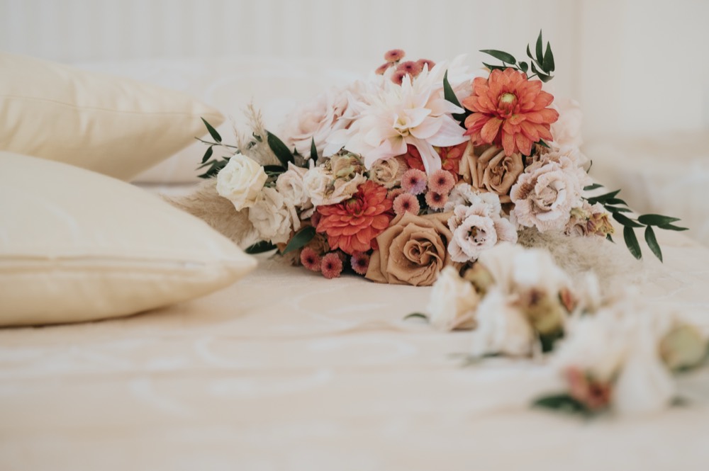 Bouquet resting on the bed