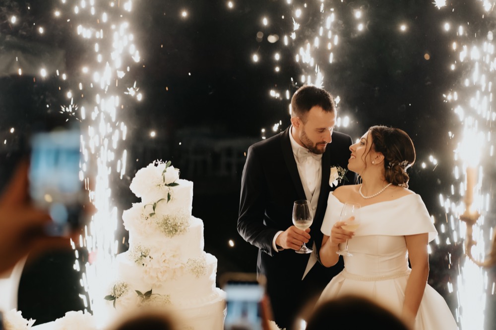 A toast between the cake sparklers
