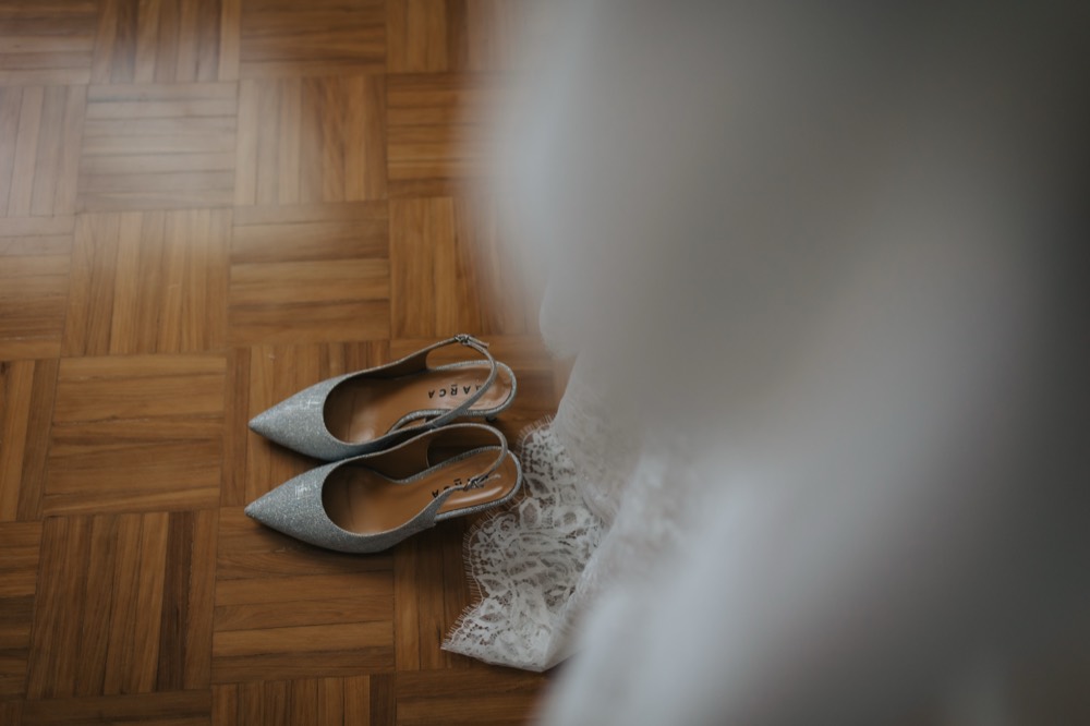 The bride’s shoes on the parquet
