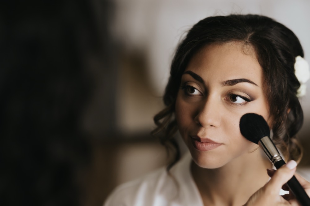 The bride having her make-up done